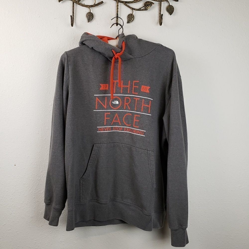 The North Face gray hooded sweatshirt orange logo